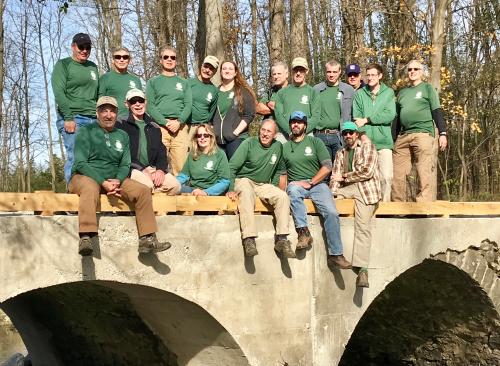 Long Distance Trails Crew celebrates the repaired Seely Brook Bridge in Goosepond Mountain State Park. Photo by Marty Costello.