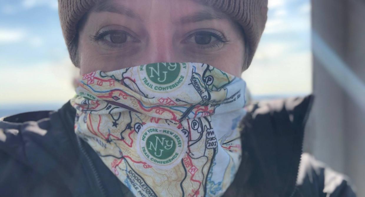 Hiker with a Harriman-Bear Mountain Trails Map Neck Gaiter. Photo by Diana Richards.